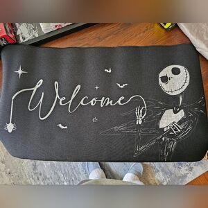 Black Welcome Mat with Jack Skellington Design